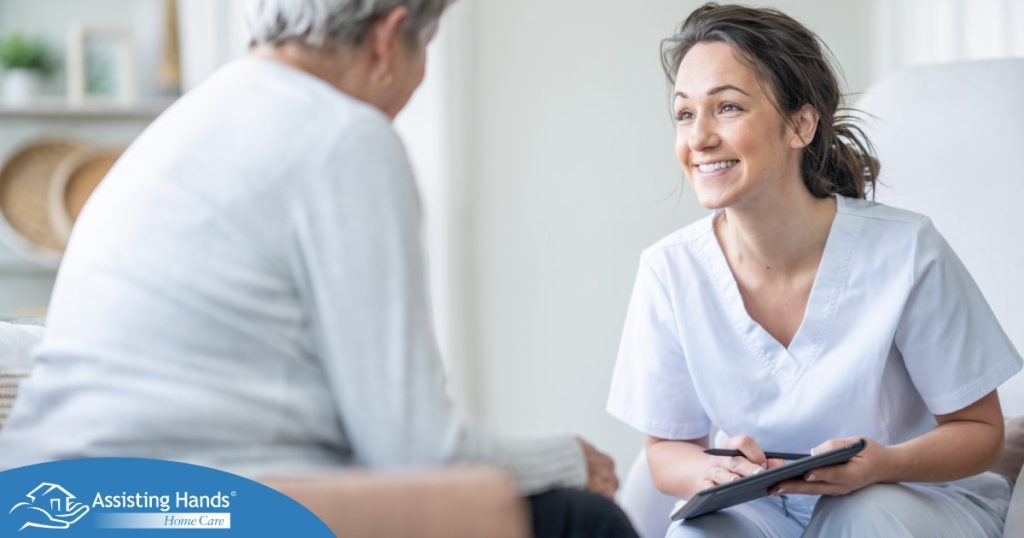 A woman smiles while with a client representing the pros of the home care industry.