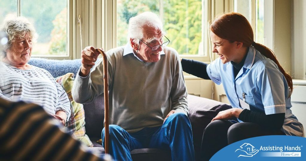 A woman has a good time with her older clients, representing the kind of personal skills needed to be a good caregiver.