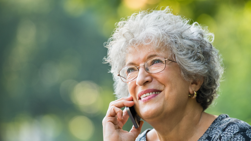 Elderly Woman on the Phone - Assisting Hands Home Care