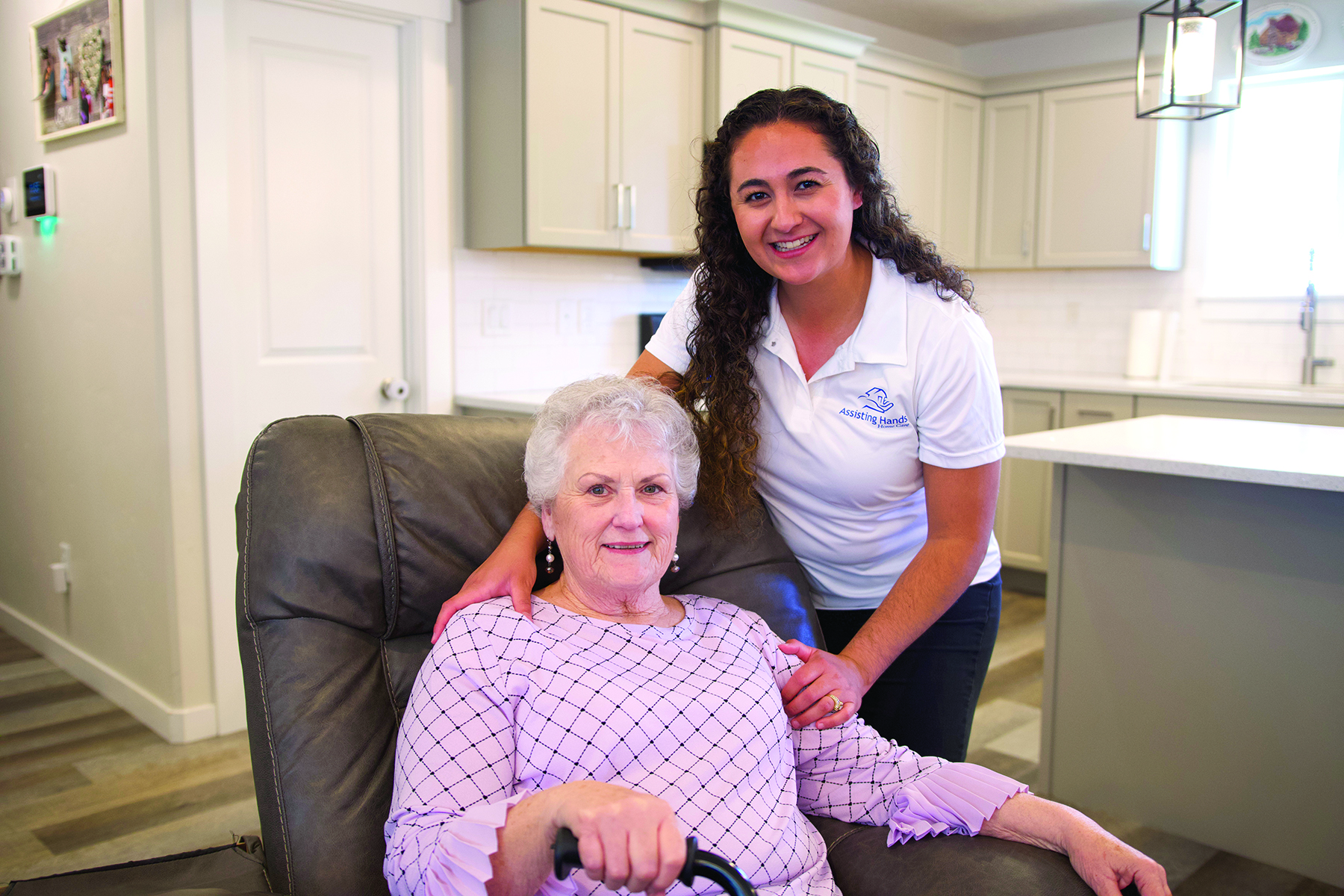 Elderly woman and caregiver - Assisting Hands Home Care