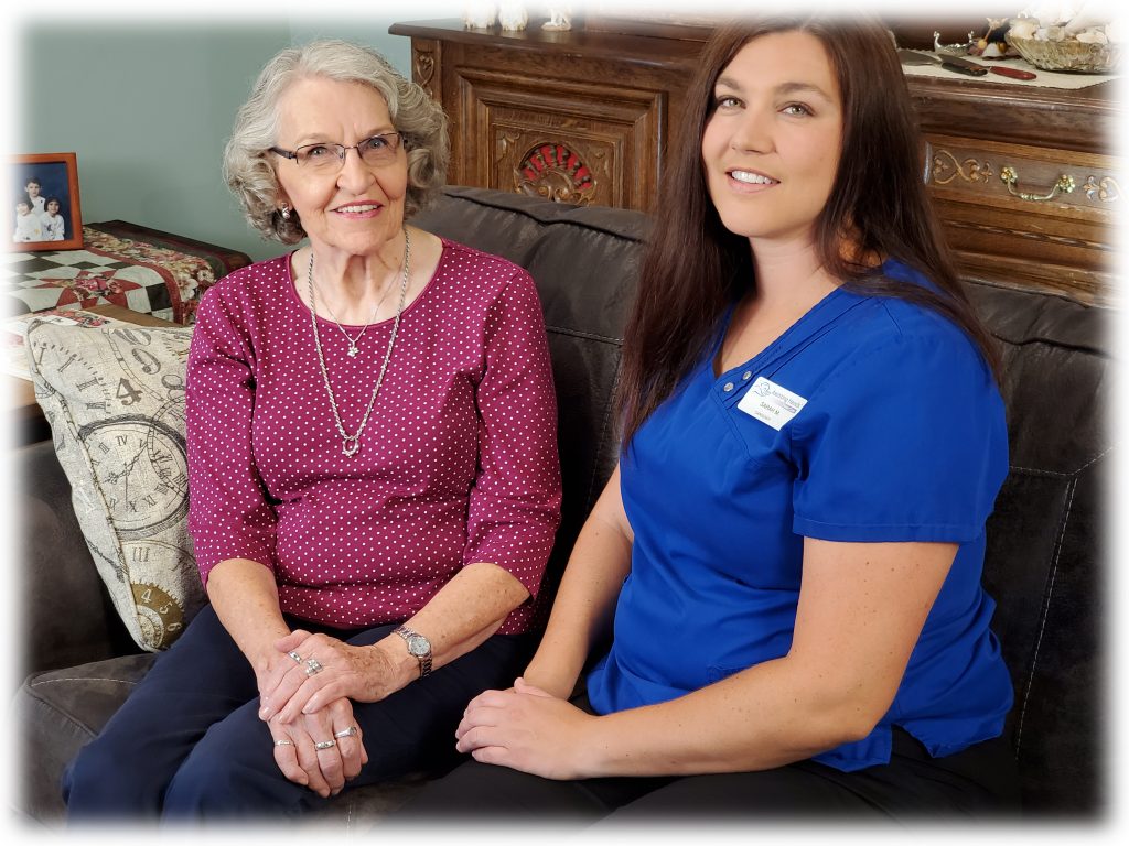 Caregiver supporting a senior while family enjoys peace of mind at home in Davis County