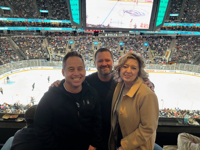 "Mike from Aspen Ridge Home Health & Hospice at a Utah Mammoth hockey game with the Assisting Hands Home Care team."
