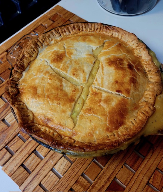 Homemade chicken pot pie prepared by a caregiver and senior client during in-home care in Davis and Weber County, supporting independence and aging in place.