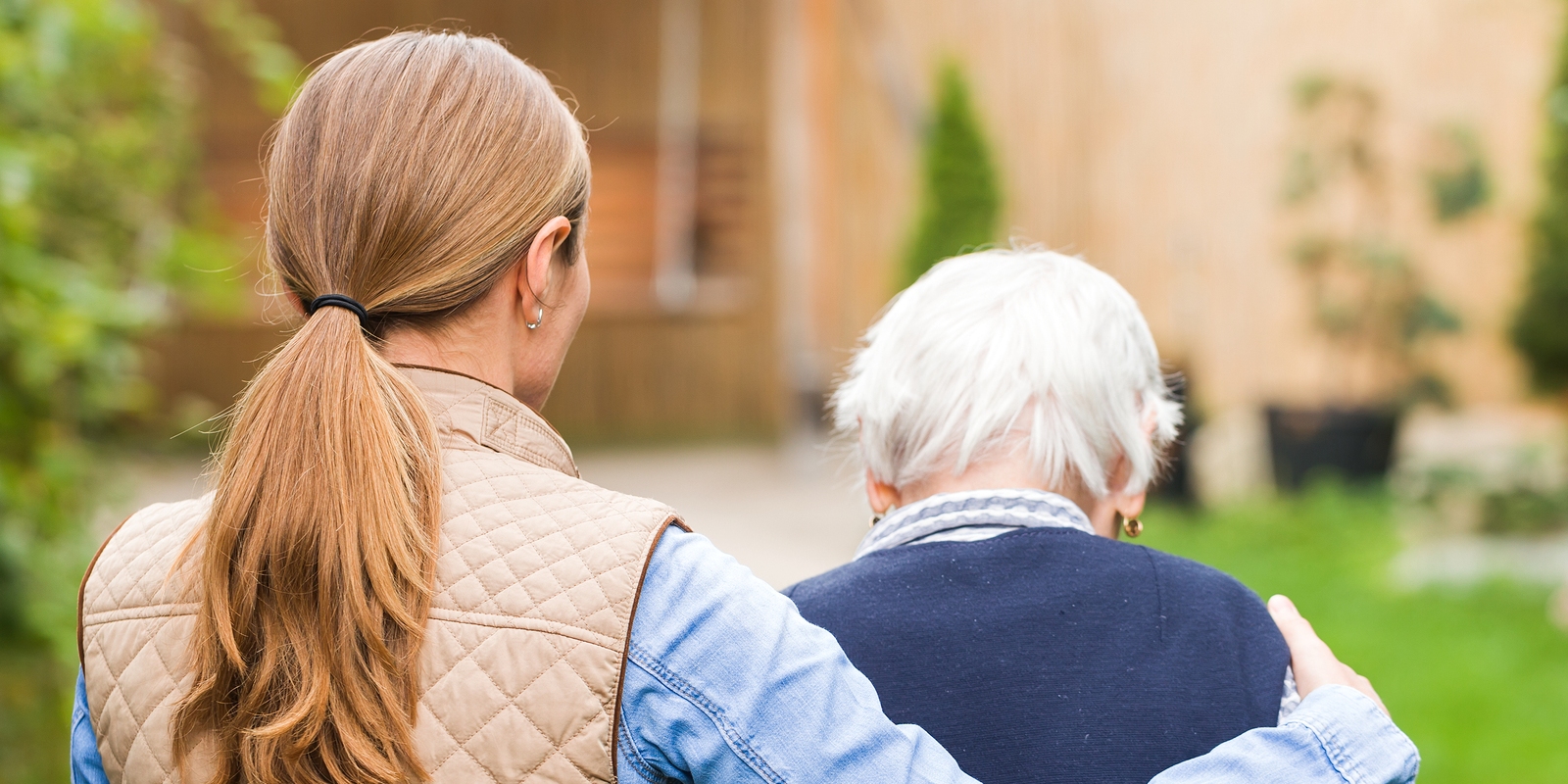 Caregiver-Helping-Elderly-Woman-Walk