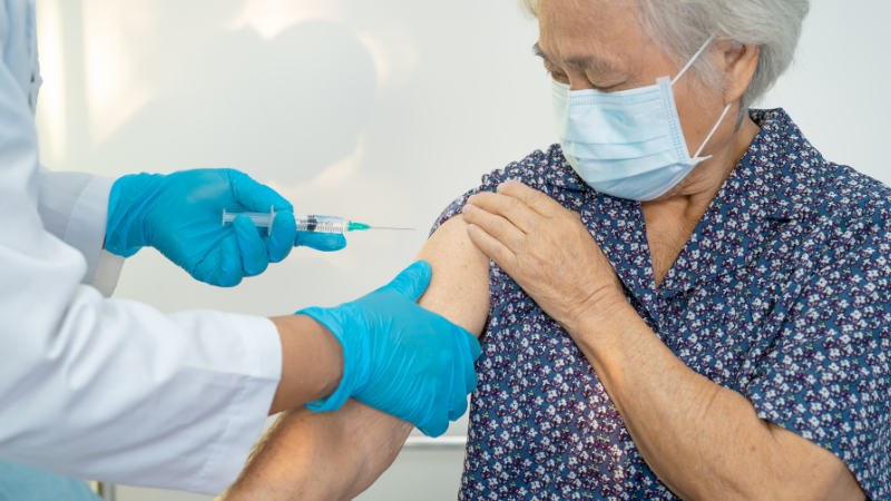 senior man getting vaccination