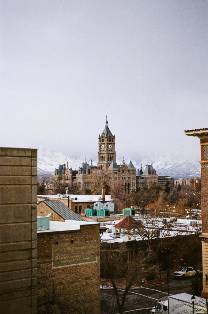 A winter view of the historic Salt Lake County building with snow-capped mountains in the background, representing the local government that provides vital community resources for seniors across Murray, Taylorsville, Cottonwood Heights, and surrounding cities. Salt Lake County's programs work hand in hand with senior home care in Murray, UT to help older adults stay healthy, connected, and aging comfortably in their own homes. For families exploring home care near me in Murray, UT, these county resources are a valuable and often overlooked first step.