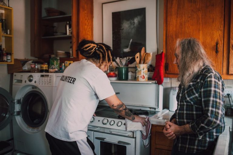 Caregiver preparing a meal in the kitchen
