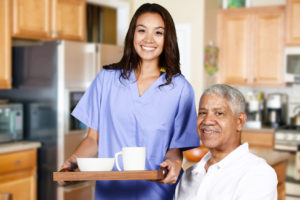 Caregiver-Serving-Senior-Breakfast