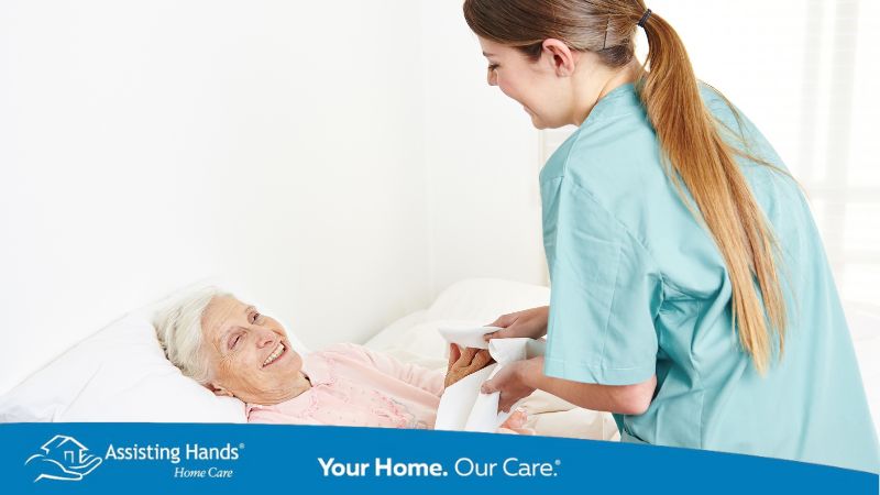 caregiver taking care of elderly woman who is in hospice caregiver taking care of elderly woman who is in hospice