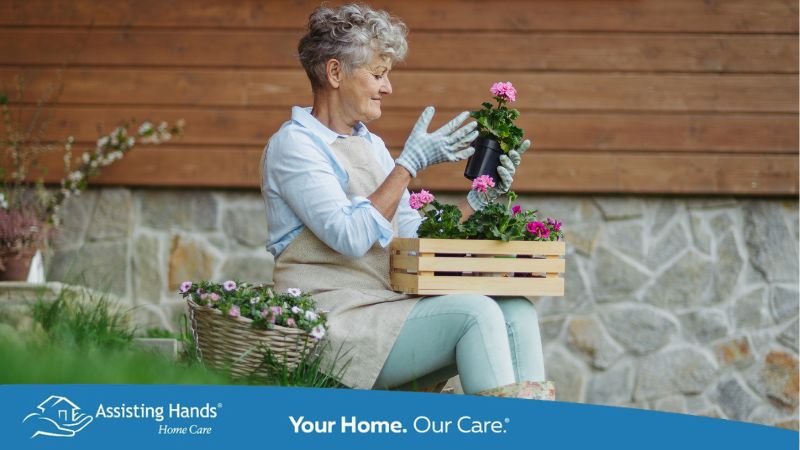 senior woman gardening in container pots on patio