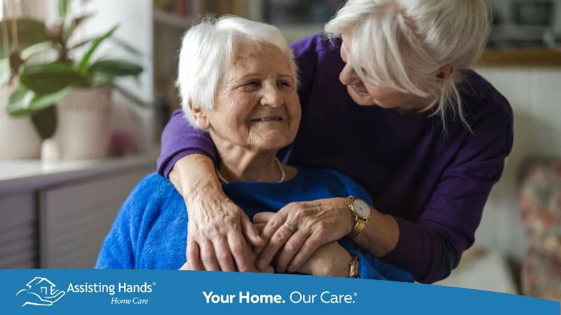 Woman hugging her elderly mother and checking on her