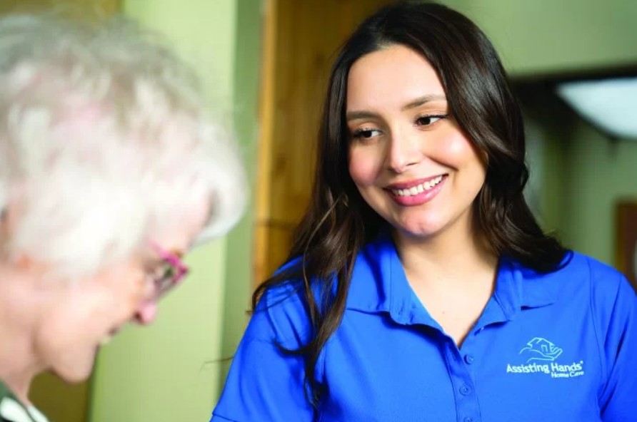 Assisting Hands Caregiver with Dementia Senior Woman
