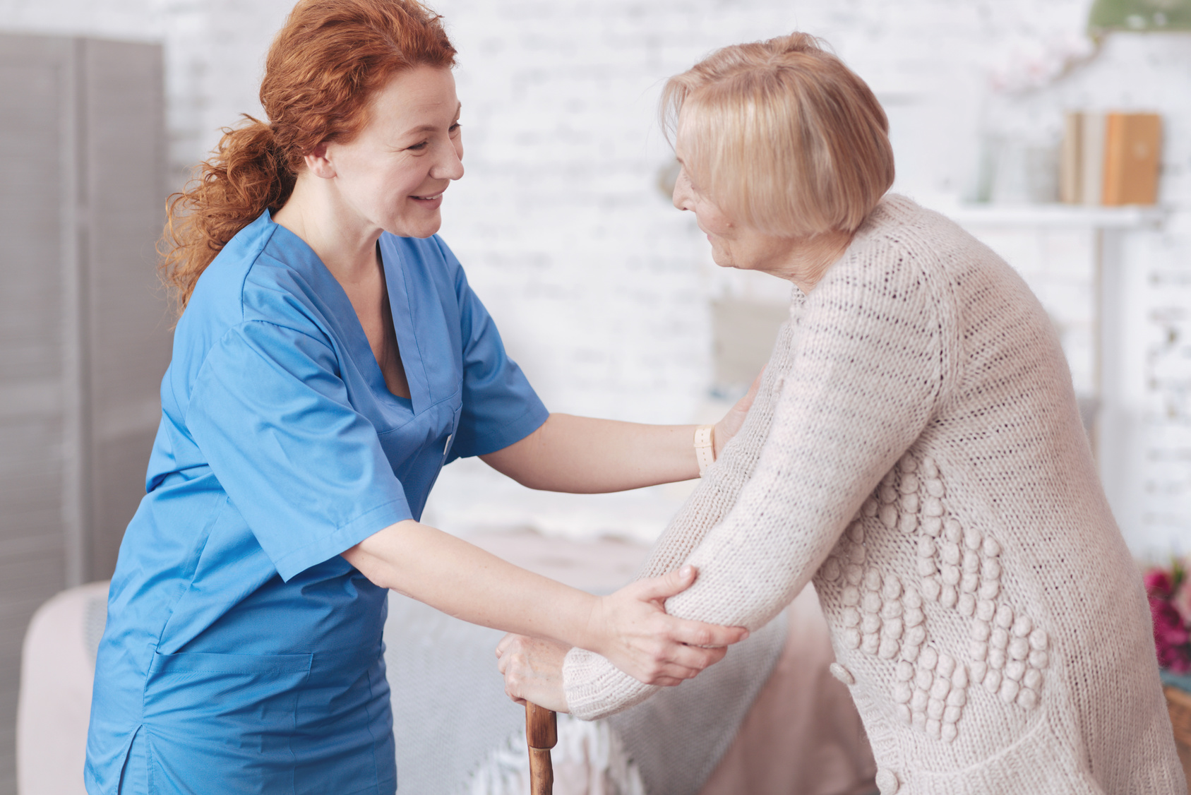 Caregiver-Helping-Elderly-Woman-Talking