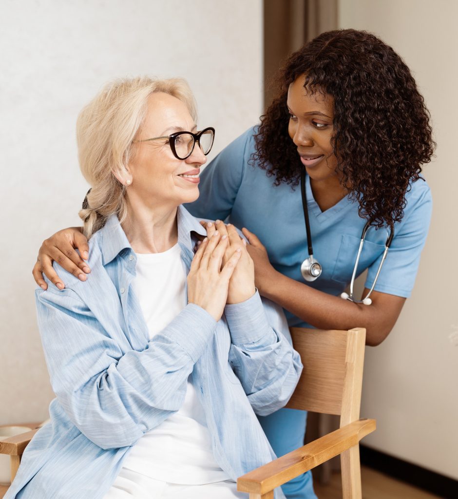 Nurse Providing Compassionate Care To Elderly Woman, Highlighting Support And Trust In Healthcare Setting