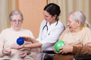 senior women using fitness balls