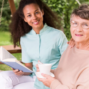 Caregiver-with-Elderly-Woman-Reading