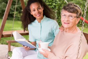 Elderly-Woman-Caregiver-Reading