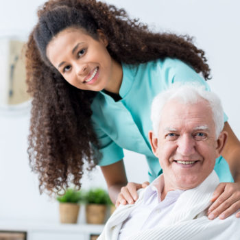 Caregiver-Standing-with-Senior