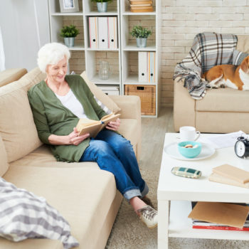 Happy-Senior-Reading-at-Home