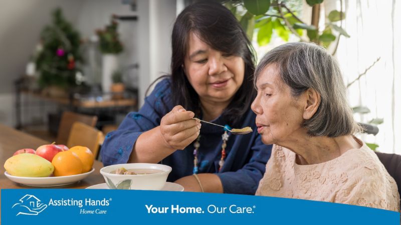 caregiver-feeding-healthy-diet-to-senior-to-manage-high-potassium-levels