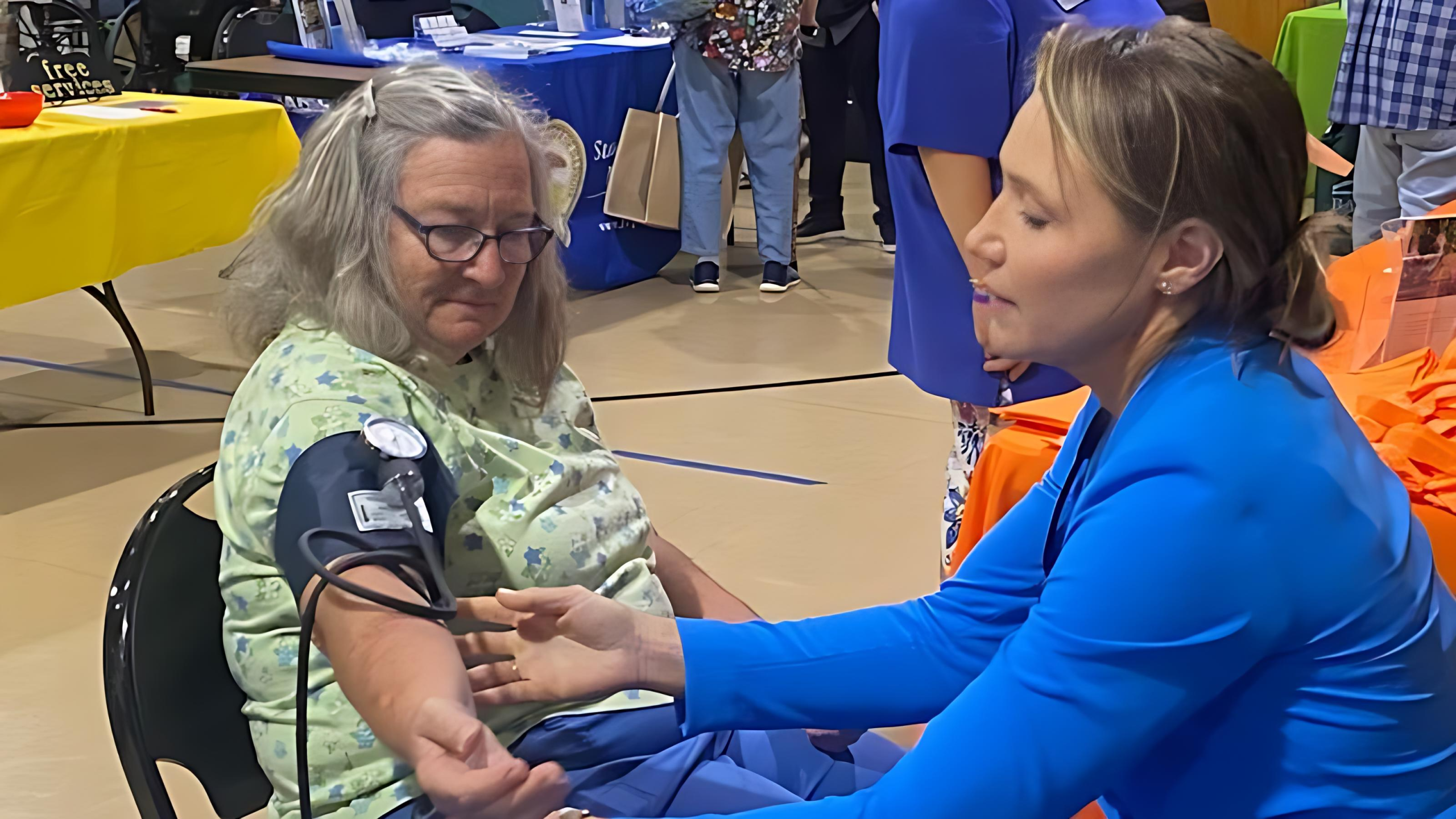 Senior performing health checkup with the caregiver