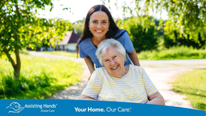 Assisting Hand Home Caregiver With Senior Woman