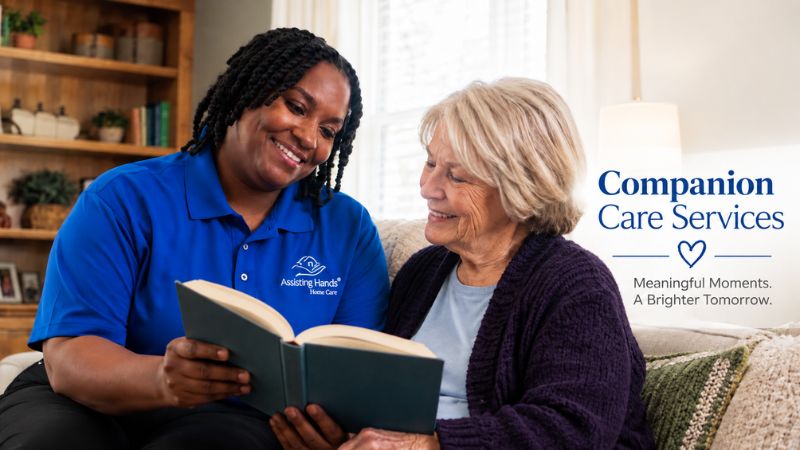 companion caregiver reading book to senior woman