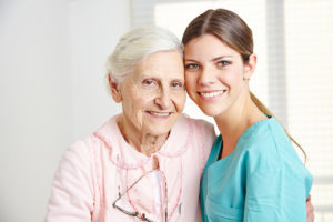 Smiling senior hugging caregiver Senior Care Services for Margate, FL