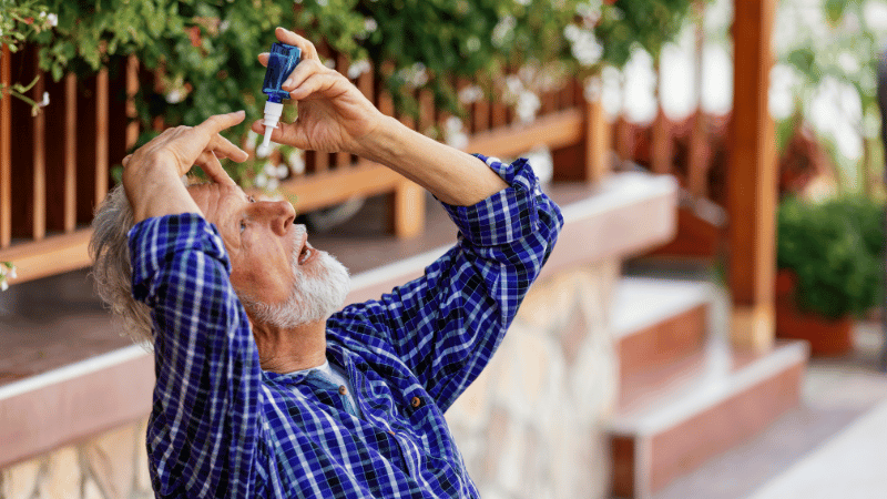 Senior using eye drops to help with dry eyes