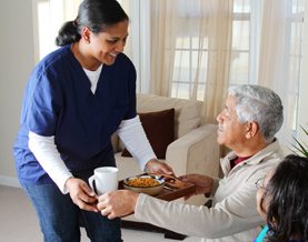Caregiver-Bringing-Senior-Food