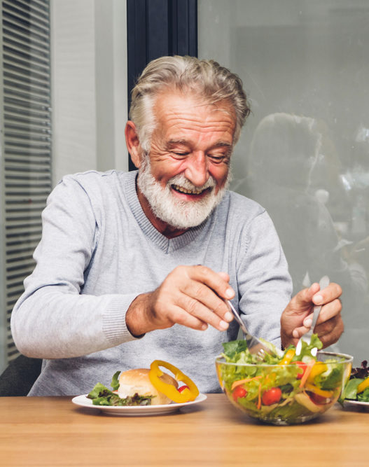 Senior man enjoy eating a healthy breakfast in his kitchen Senior man enjoy eating a healthy breakfast in his kitchen