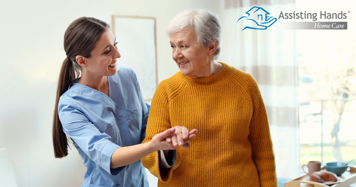 Professional caregivers, like this one who is helping a senior client walk, require a number of qualities and skills to provide compassionate personal care.