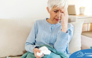 An older sick woman represents what family caregivers want to avoid, especially during flu season.