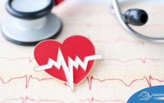 A heart symbol with an electrocardiogram line, an electrocardiogram sheet, and a stethoscope represents heart health.