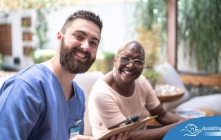 A caregiver and client smile showing that a career as a caregiver can be rewarding.
