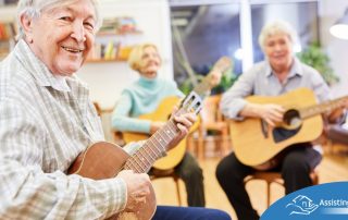 A group of seniors enjoy playing instruments together showing the impact of music for older adults.