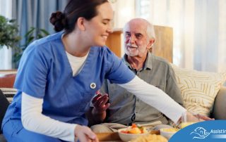 Caregiver providing senior care at home to manage parkinson’s and related symptoms.
