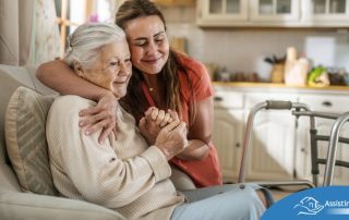 Caregiver supporting an elderly woman in the transition to senior home care