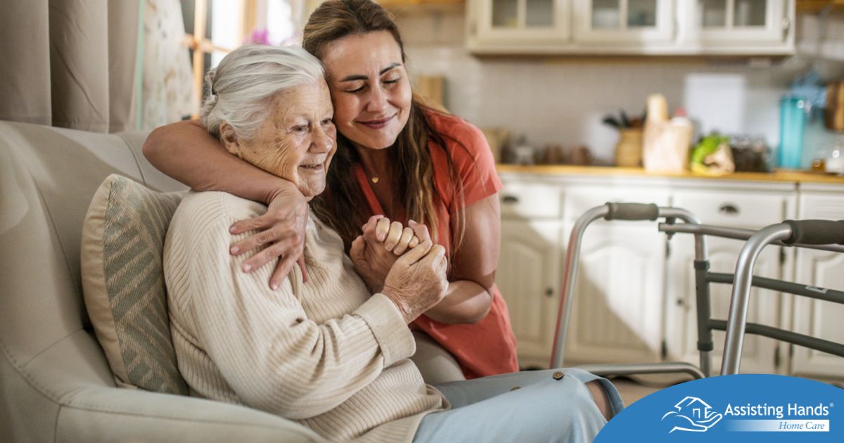 Caregiver supporting an elderly woman in the transition to senior home care