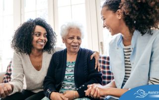 Caregiver talking to a family about Elderly Care