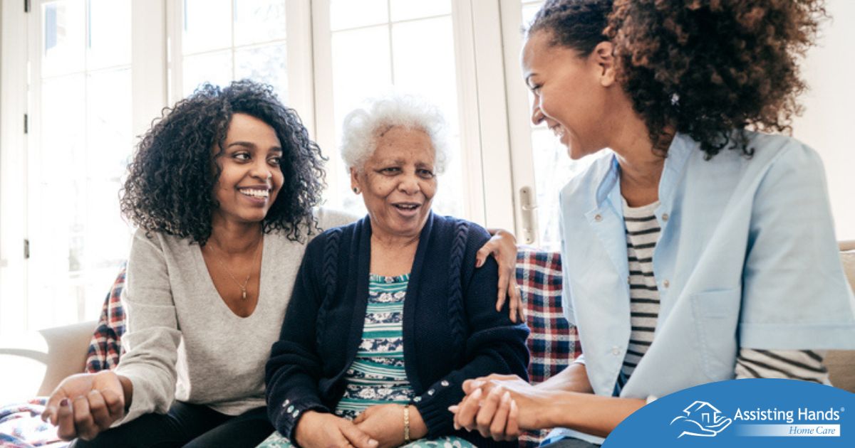 Caregiver talking to a family about Elderly Care