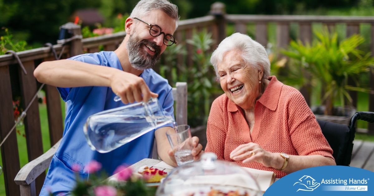 A caregiver applies summer Caregiving Tips including helping a senior stay hydrated.