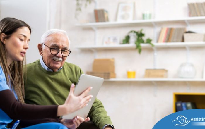 Home caregiver assisting senior man to use telehealth and senior care