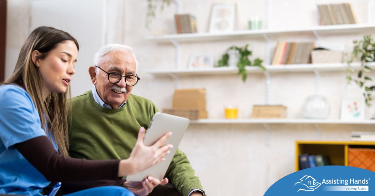 Home caregiver assisting senior man to use telehealth and senior care