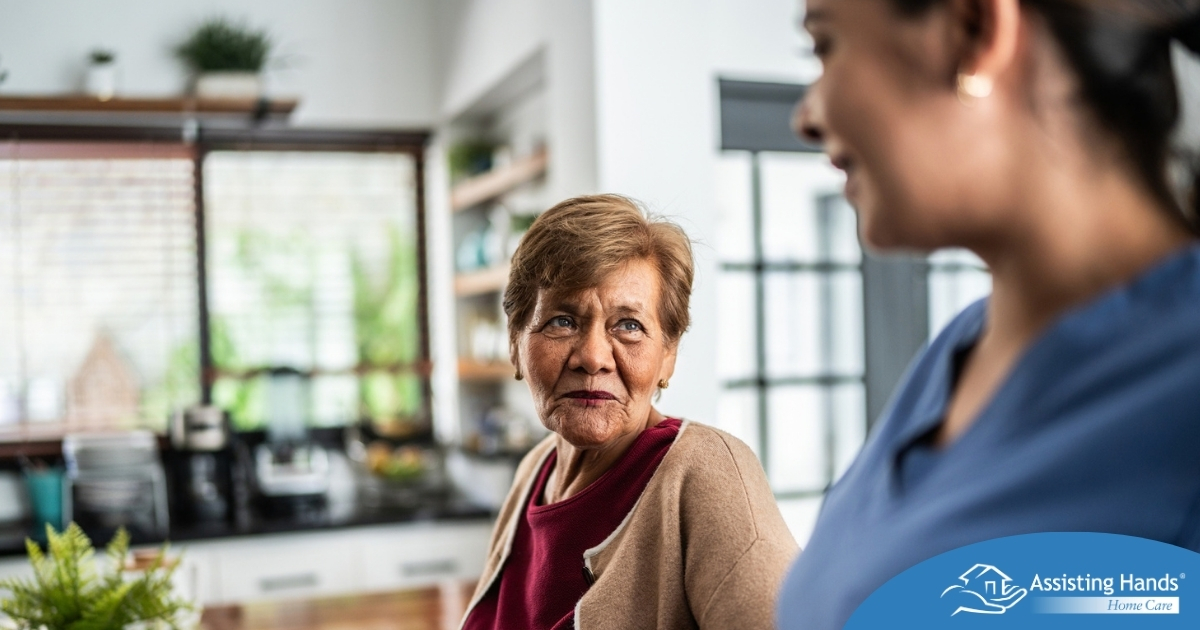Caregiver provides attentive senior care as part of diabetes awareness
