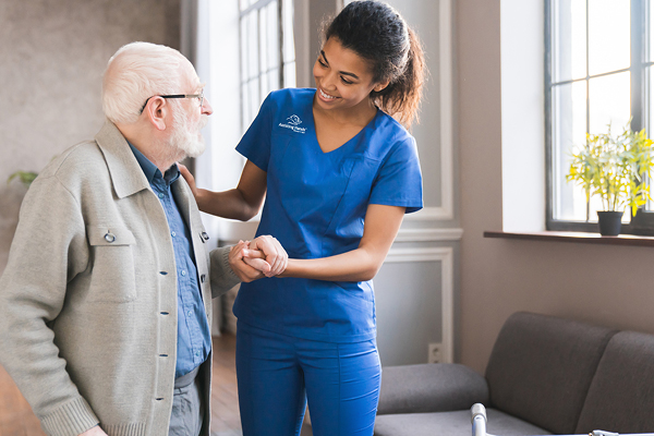 Caregiver helping gentleman