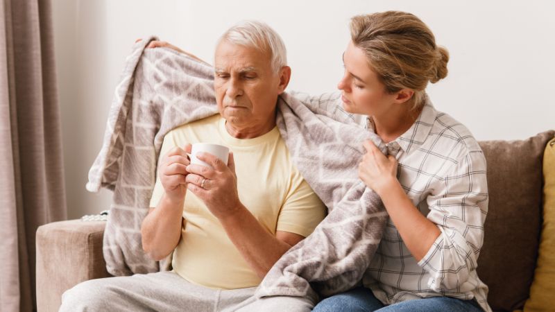 family-caregiver-keeping-the-elderly-warm