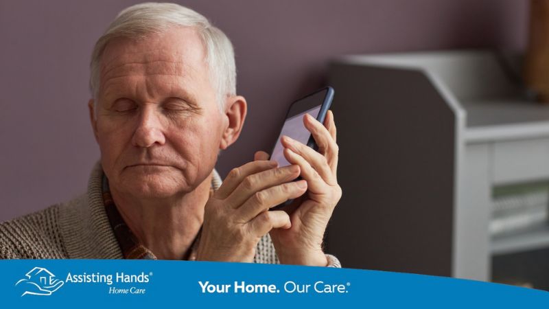 senior man using assisted technology to help him with dementia