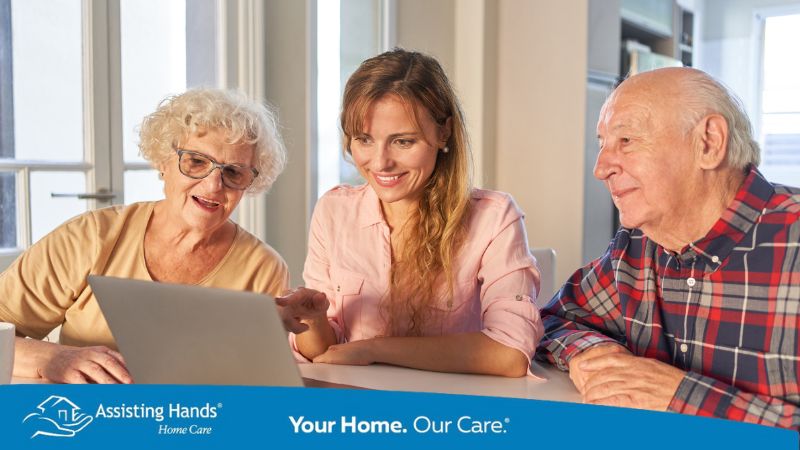 Daughter supporting her senior parents while reviewing and comparing respite care costs in Illinois.