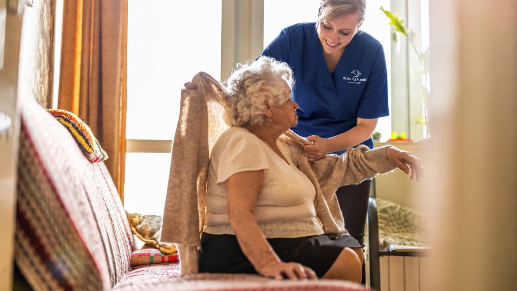 Assisting Hands Caregiver Dressing Senior Woman Assisting Hands Caregiver Dressing Senior Woman